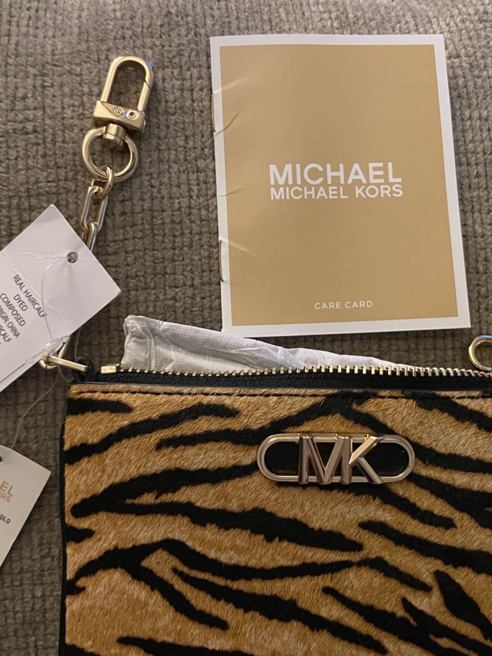 Michael Kors Tiger Stripe Haircalf Wristlet in Black and Tan with Gold Hardware
